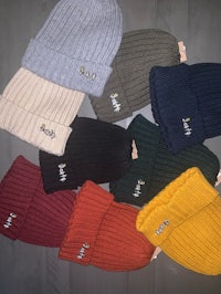 a group of beanie hats in different colors
